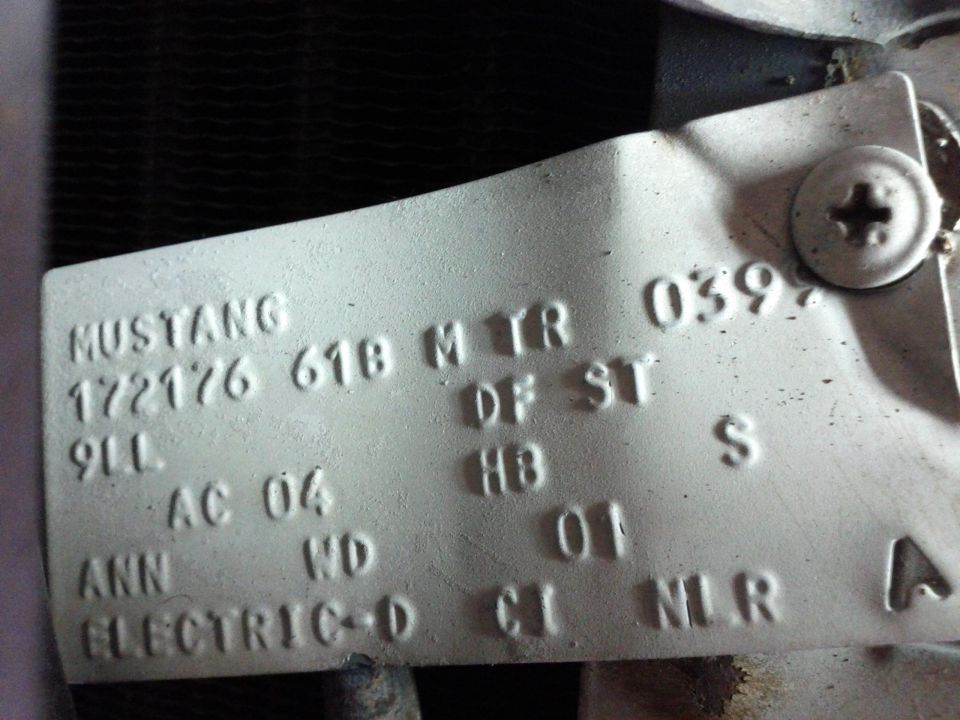 Mustang VIN plate with stamped numbers and letters