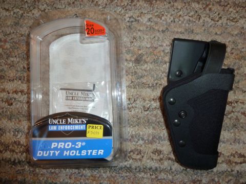 1992 Ford Mustang - An Uncle Mike's Law Enforcement Pro-3 Duty Holster is shown both in its original packaging and as a separate item.