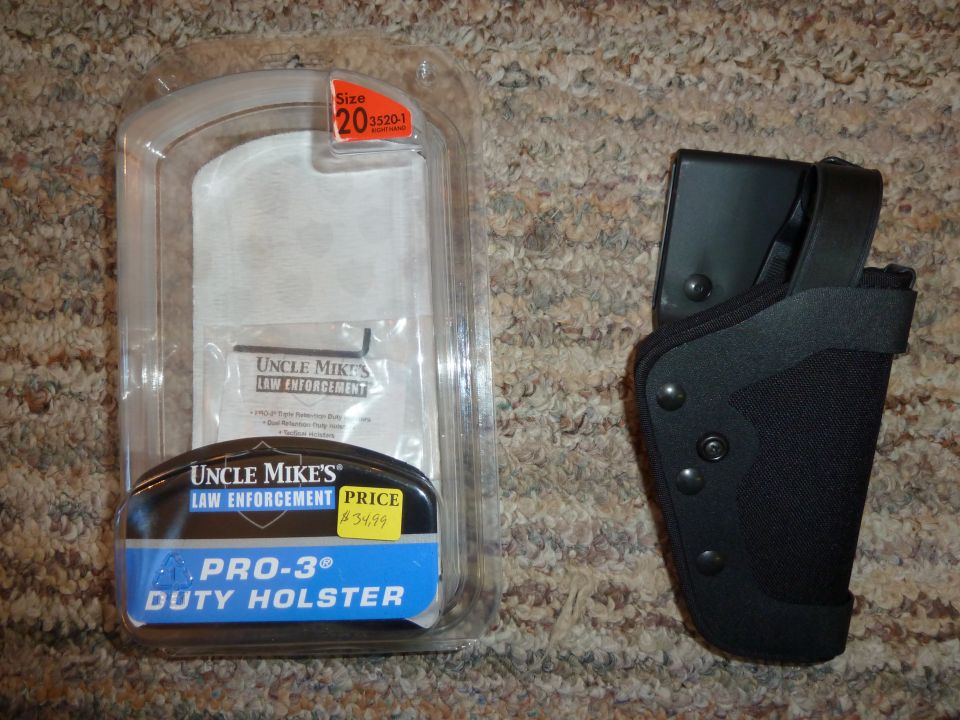 Uncle Mike's Law Enforcement Pro-3 Duty Holster in packaging and separate