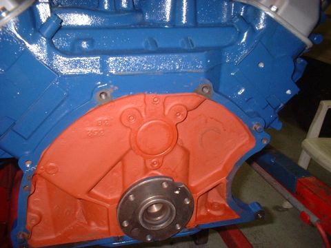 1969 Mercury Cyclone - Close-up view of a blue and orange painted engine block, showing casting marks and a flange for a crankshaft seal.