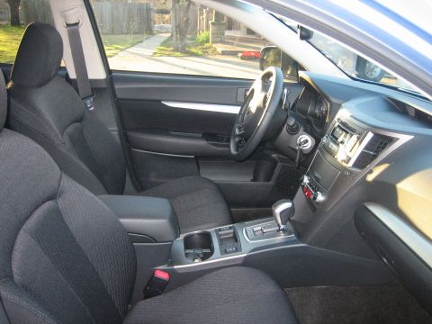 1996 Ford Thunderbird - The interior of a car is shown from the passenger side, looking towards the driver's seat and dashboard.