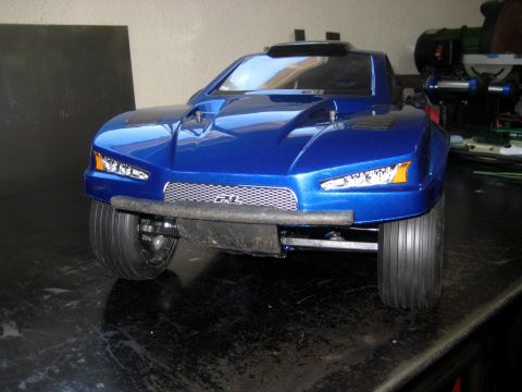 1996 Ford Bronco - Front view of a blue RC car with a prominent grille and headlights.