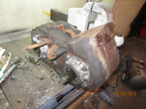 1979 Ford Bronco - This is a transfer case, likely from an older 4x4 vehicle, sitting on a workbench.