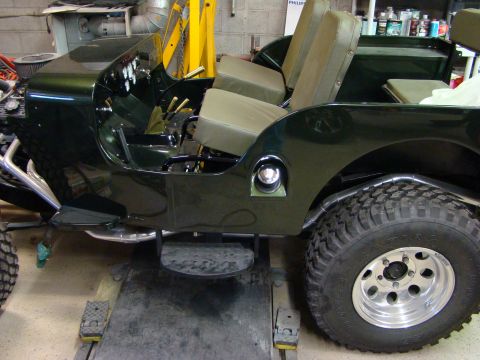 1948 Jeep Wrangler - Side view of a 1948 Jeep CJ-3A showing the interior and exterior details.