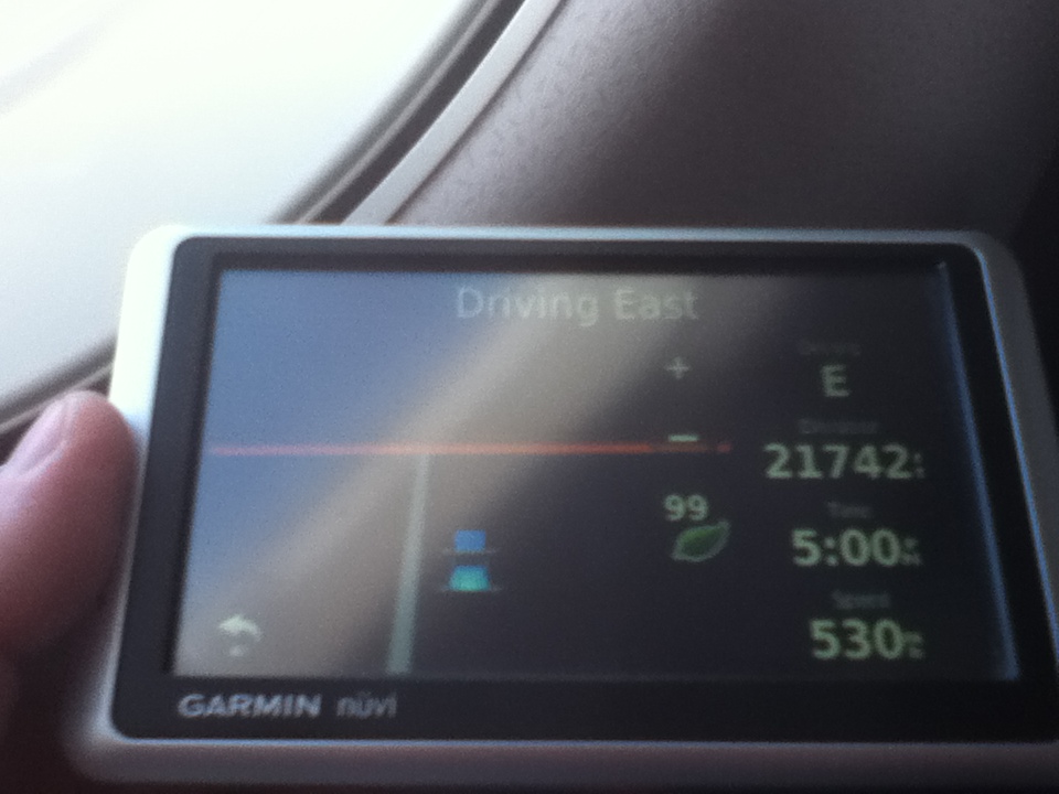 Garmin nuvi GPS screen showing driving east, distance 21742, time 5:00, and speed 530