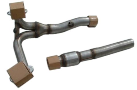 1990 Ford Bronco - Two sections of a metal exhaust system, likely a Y-pipe and a muffler delete pipe.