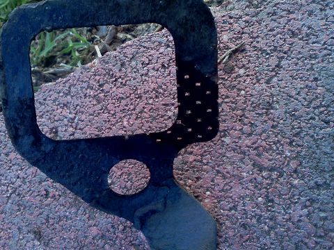 1989 Ford Bronco - This is a close-up view of an exhaust manifold gasket, likely for an older vehicle.