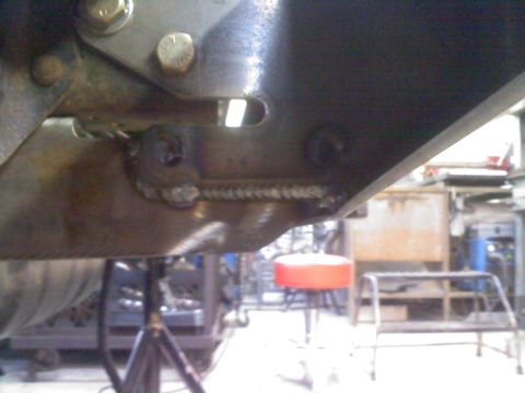 1996 Ford Bronco - Close-up view of a welded metal bracket, likely part of a custom suspension build.