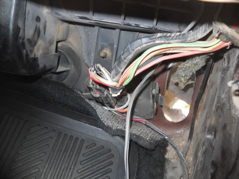 1992 Ford Explorer - Interior view of a vehicle's wiring harness and floor mat, with no visible year identification.