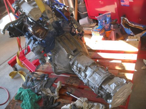 1992 Ford Explorer - This engine and transmission assembly is being worked on in a garage setting.