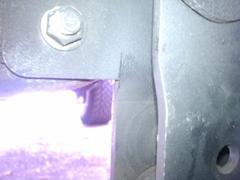 1993 Ford Bronco - Detail of a vehicle's frame and a tire, viewed from a close-up angle.