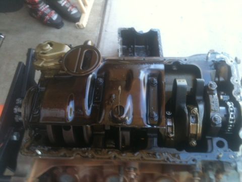1988 Ford Bronco II - Close-up view of an engine's internal components, including the crankshaft and oil pan.