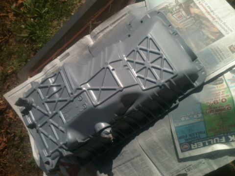 1988 Ford Bronco II - A gray Ford oil pan, likely for an older model truck or SUV, is shown after being painted.