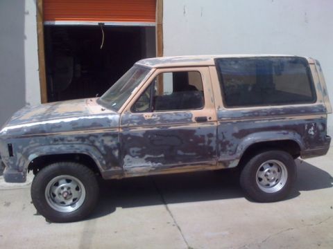 1988 Ford Bronco II - This 1988 Ford Bronco II is undergoing bodywork, showing primer and bare metal.