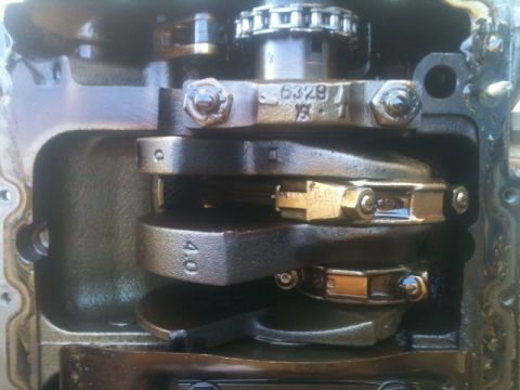 1988 Ford Bronco II - Close-up view of engine crankshaft and connecting rods, showing internal engine components.