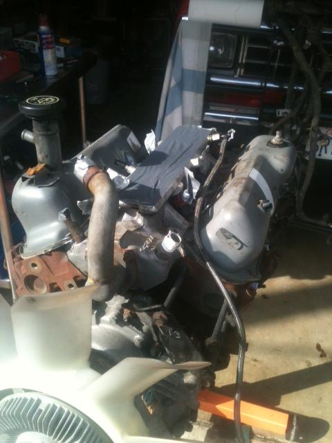 1988 Ford Bronco II - Engine components are visible in this close-up shot, with a fan in the foreground.
