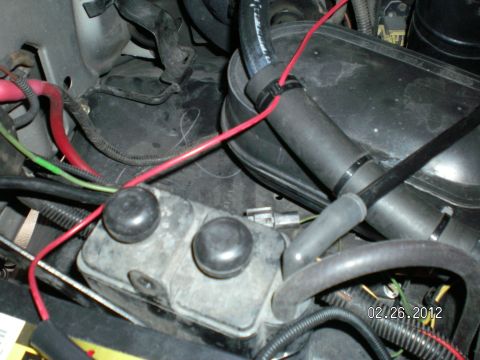 1996 Ford Bronco - This is where I moved the charcoal canister to mount the aux trans filter. I just zip tied the canister to the battery support bracket and…