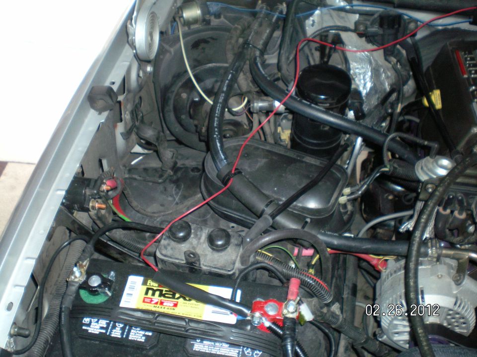 Here's a "top view" of the re-located canister, the shortened plastic hose, and the replacement silicone hose......came out pretty nice!
