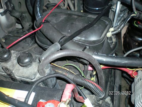 1996 Ford Bronco - The other end of the silicone hose runs to a metal tube and back to the fuel tank........