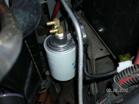 1996 Ford Bronco - Even though this filter is mounted way up and out of harms way, I can fill the filter with Mercon V and reach in through the engine compart…