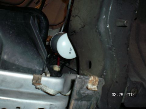 1996 Ford Bronco - Close-up view of an auxiliary transmission filter, likely from a vehicle's undercarriage.