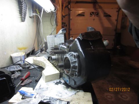 1979 Ford Bronco - NP205 transfer case on a workbench, likely undergoing maintenance or repair.