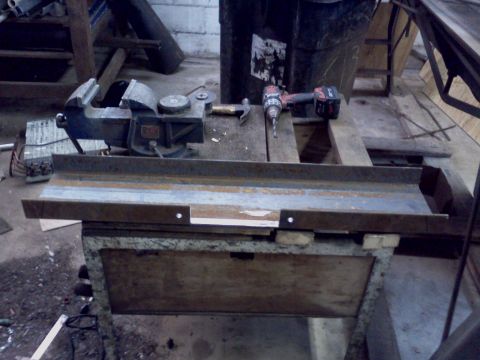 1989 Ford Bronco - A workbench scene shows a vise, hammer, and cordless drill on a wooden surface.