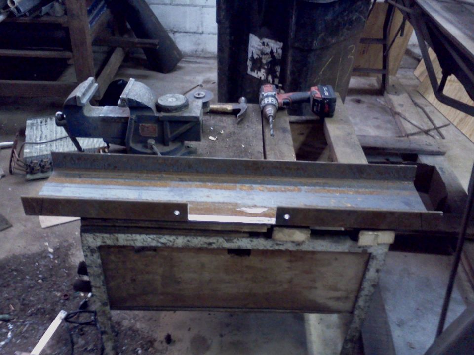 Workbench with vise, hammer, and drill