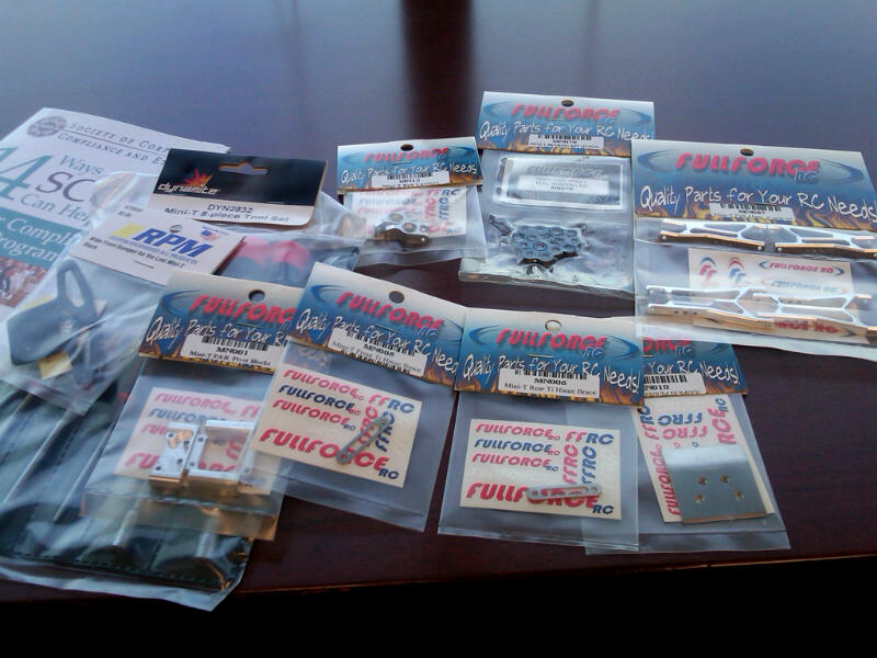 RC car parts in plastic packaging on a table