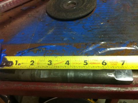 1989 Ford Bronco - A metal shaft is measured with a tape measure, showing approximately 6 inches.