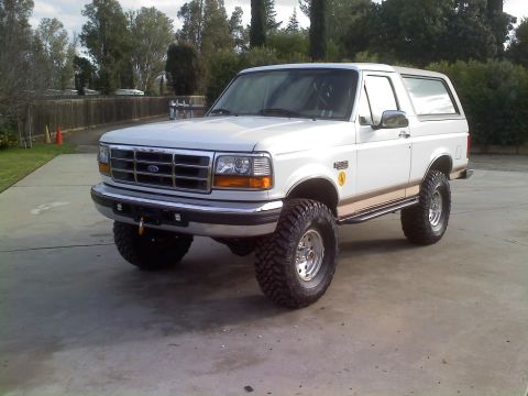 1996 Ford Bronco - This lifted 1996 Ford Bronco features large off-road tires and a two-tone paint scheme.