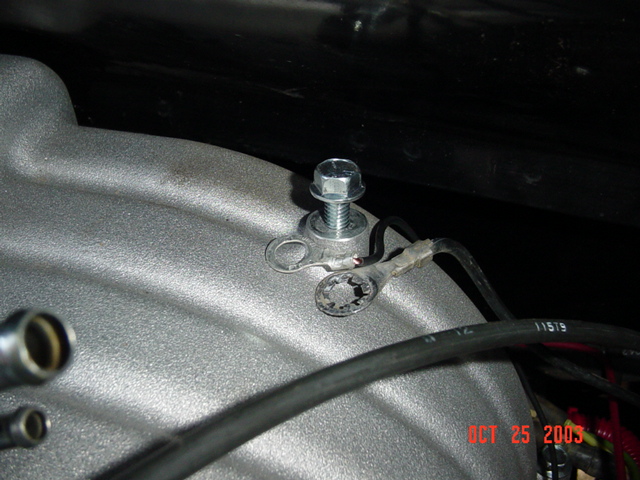 Remove the ground straps from the rear of the manifold