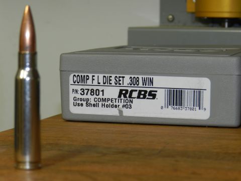 1996 Ford Bronco - A single bullet sits beside an RCBS reloading die set, labeled for .308 WIN cartridges.