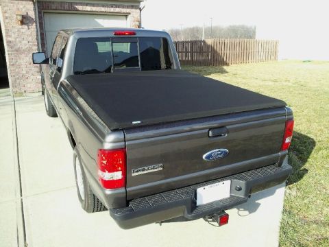 2011 Ford Ranger - Rear view of a dark gray Ford Ranger pickup truck equipped with a black tonneau cover.