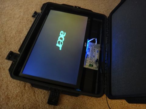 1993 Ford Taurus - An Acer monitor is set up inside a black protective case, displaying its logo.