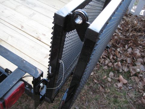 2005 Jeep Wrangler - A close-up view of a trailer ramp shows its construction with metal grating and a wooden deck.