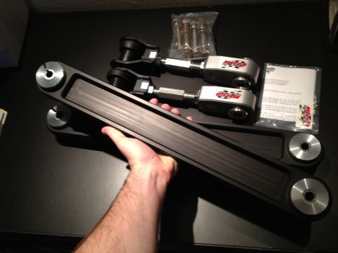 1992 Ford Crown Victoria - Metco control arms are shown, with a hand holding one of the parts.