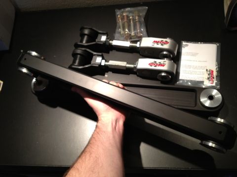 1992 Ford Crown Victoria - A set of Metco Control Arms, including hardware and installation instructions, are laid out on a dark surface.