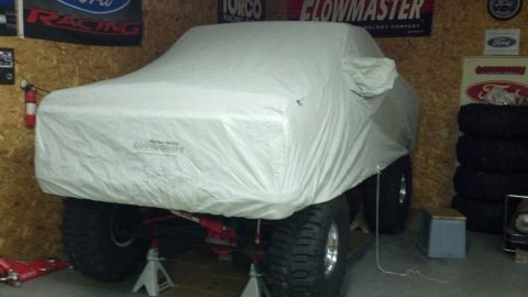 1978 Ford Bronco - Vehicle is covered, making year and model identification impossible from this view.
