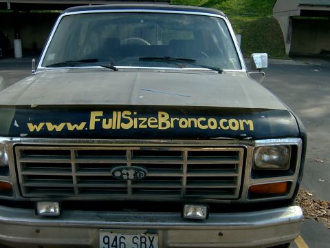 1982 Ford Bronco - Front view of a Ford Bronco, a bug shield with "www.FullSizeBronco.com" printed on it.