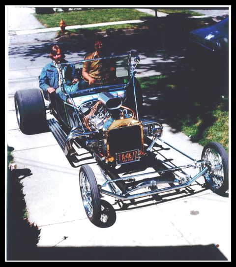 1968 Ford Mustang - A custom-built hot rod sits in a driveway with two occupants, ready for a drive.