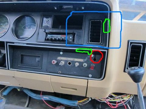 1987 Dodge 1500 - Interior view of a vehicle's dashboard, climate controls and radio.