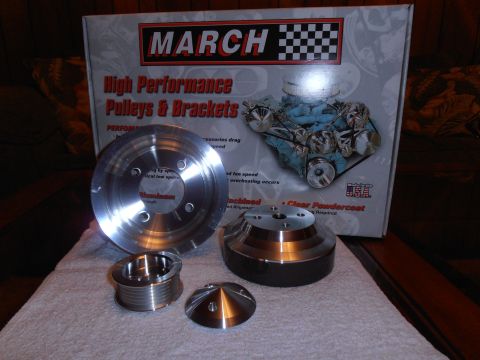 1990 Ford Bronco - March Performance pulleys and brackets are displayed in front of their product box.