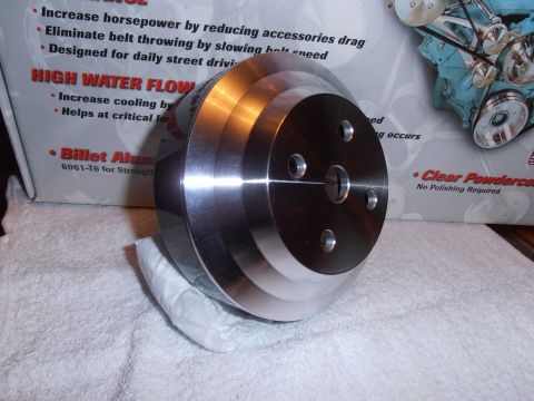 1990 Ford Bronco - A close-up of a multi-groove billet aluminum pulley, likely an aftermarket automotive part.