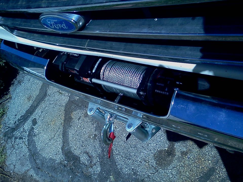 Ford emblem on grille above a winch installed in the bumper