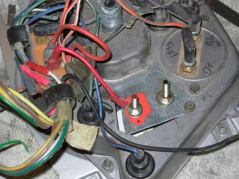 1975 Ford Bronco - The paper insulator prevents the hot side from shorting to the plate; the steel washer on the ground side helps it connect to the plate, bu…