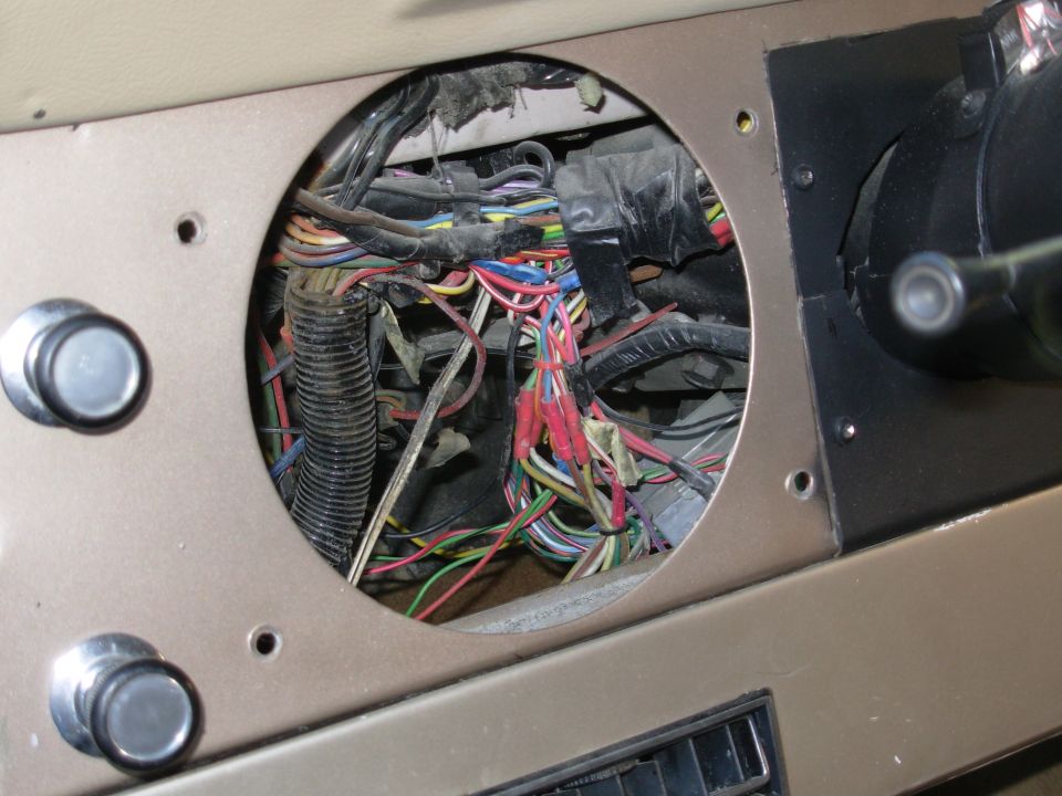 Just a shot of the clearance behind the cluster.  This truck has a LOT of extra wiring since the whole harness came from an '88 F150 XLT.

I had to unbolt the top of the e-brake so the dash face would swing forward to allow the cluster to fit out the back.