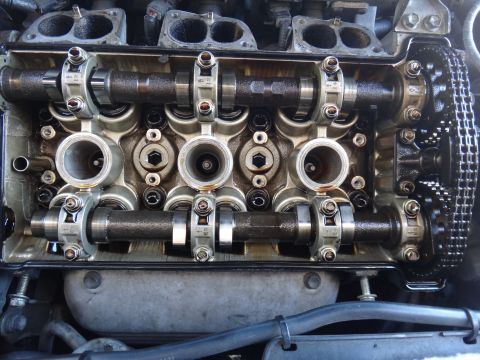 1993 Ford Taurus - Close-up view of an engine's internal valve train components, including camshafts and a timing chain.