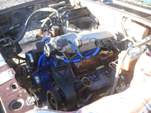 1992 Ford Explorer - Engine bay view with engine, hoses, and pulleys visible.
