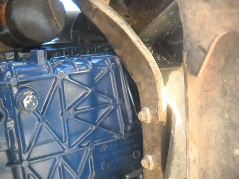 1992 Ford Explorer - Blue engine part with visible casting marks and fasteners, likely from a vehicle's drivetrain.